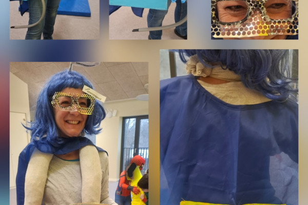 Kostümierte Kollegin aus der Kita Wallenberg Straße trägt Viren-Schutzschild